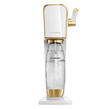 Gold-trim sparkling water maker with drip stand and clear carbonating bottle