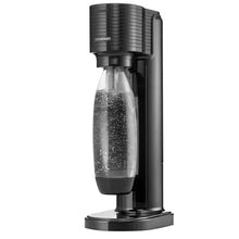 Black sparkling water maker with clear carbonating bottle and round base