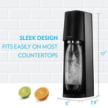 SodaStream Terra sparkling water maker on countertop with a bottle of bubbles