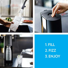SodaStream sparkling water maker with a bottle being filled, creating fizzy water
