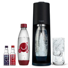 SodaStream Terra sparkling water maker with Cherry Bubly bottle and filled glass, black