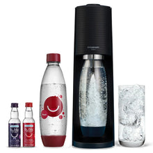SodaStream Terra sparkling water maker starter kit with black base, water bottles, and filled bottle