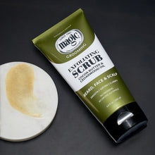 Exfoliating scrub tube with pale yellow exfoliating gel on a dish