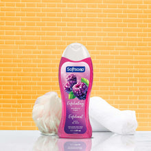 Exfoliating body wash bottle with purple-pink label and blackberry sugar floral graphics