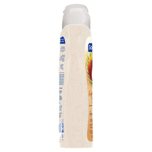 Softsoap exfoliating body wash bottle side view with coconut butter scrub label
