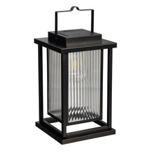 Black solar LED lantern with handle on top and vertical glass light panels.
