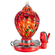 Glass hummingbird feeder bulb with red base and small perch bird figurine