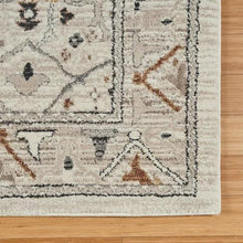 Ivory runner rug border with geometric corner motif and dark framing lines.