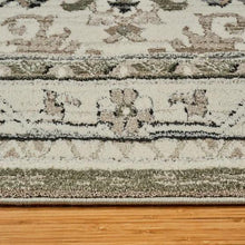 Sage and cream runner rug edge with plush short pile texture
