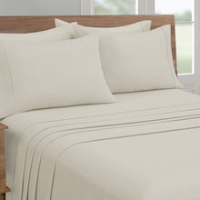 Microfiber sheet set with solid beige cover and pillowcases in close-up view