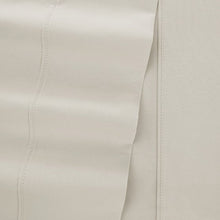 Microfiber sheet set close-up of solid light fabric seam and stitched edge