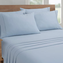 Microfiber sheet set with solid blue pillowcases and flat sheet, close-up