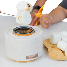 Solo Stove fire bowl with glowing center and orange warning ring on a wood base