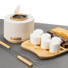 Solo Stove fire bowl with marshmallows on a wooden tray and skewers nearby