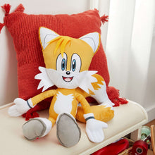 Sonic plush pillow buddy resting on a red knit throw pillow with white spiky collar