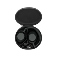 Black over-ear headphones case open with ear cups and included cables inside