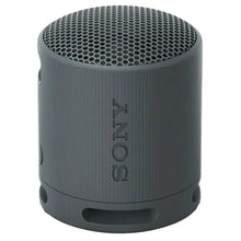 Dark gray portable Bluetooth speaker front view with top mesh grille