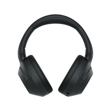 Black over-ear wireless headphones shown from the front with padded headband and cups