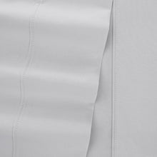 Solid white microfiber sheet set close-up of stitched seam and textured fabric weave