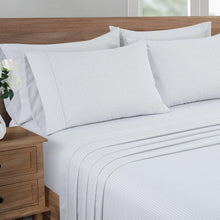 White microfiber sheet set with diamond pattern; fitted sheet and pillowcases shown
