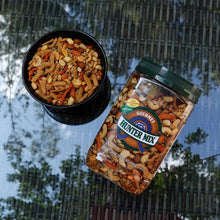 Hunter Mix jar with green lid beside bowl of mixed nuts