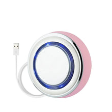 Pink circular facial skincare mask infuser with blue LED ring