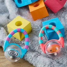Two baby rattles with colorful striped handles and clear character heads