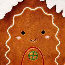 Plush gingerbread house toy face detail: brown with stitched smile and round window