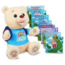 Plush storytelling bear with blue Explore shirt and illustrated storybooks beside it