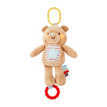 Light-up plush bear baby toy with striped bib and yellow travel hook
