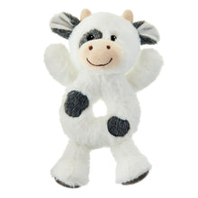 White plush cow rattle with black spots and smiling face