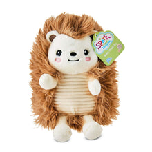 Brown hedgehog plush toy with white face, striped belly, smile, and tag attached.