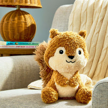 Squirrel plush toy sitting, brown fur with cream muzzle, big black eyes and smile.
