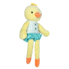 Yellow duck plush toy with orange beak, blue grid shirt, and teal shorts with orange feet