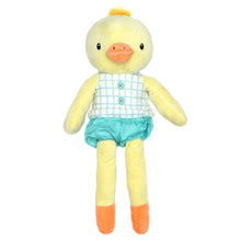 Yellow duck plush toy with orange beak, blue grid shirt, and teal shorts