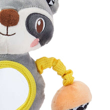 Close-up of plush raccoon with round yellow mirror and orange patterned teether