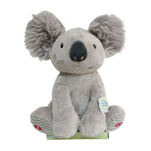 Grey koala plush toy with large ears, smiling face, and open hands, sitting upright.