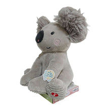 Grey koala plush toy sitting on its base with blue tag that says press to play.