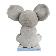 Grey koala plush toy viewed from back, showing large ears and rounded body.