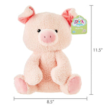 Soft pink pig plush toy, tag attached; 11.5 in tall and 8.5 in wide.