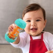 Teal and clear rainmaker rattle toy with orange blades and color beads