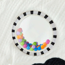 Cow plush fabric belly with round sensory window filled with colorful beads