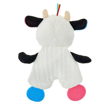 White cow plush with black ears and legs, pink and blue teether feet
