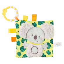 Koala taggie crinkle toy with plush koala face and green leaf patterned fabric