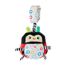 Ladybug plush travel chime toy with multicolor ring patterned body and striped arms