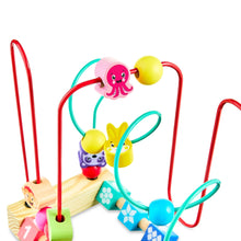 Wooden bead maze close-up with animal beads on curved colorful wire rods