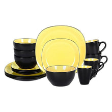 Dinnerware set with glossy yellow plates, bowls, and mugs; matte black outer rims