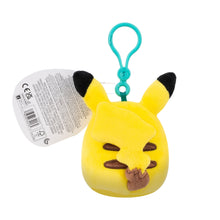 Clip-on Pikachu plush keychain with barcode label on back, teal clip