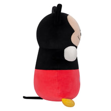 Mickey Mouse plush toy, side view, black head and red shorts with yellow feet