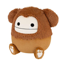 Brown Bigfoot plush toy, side view with white face, black eyes, and foot paw prints